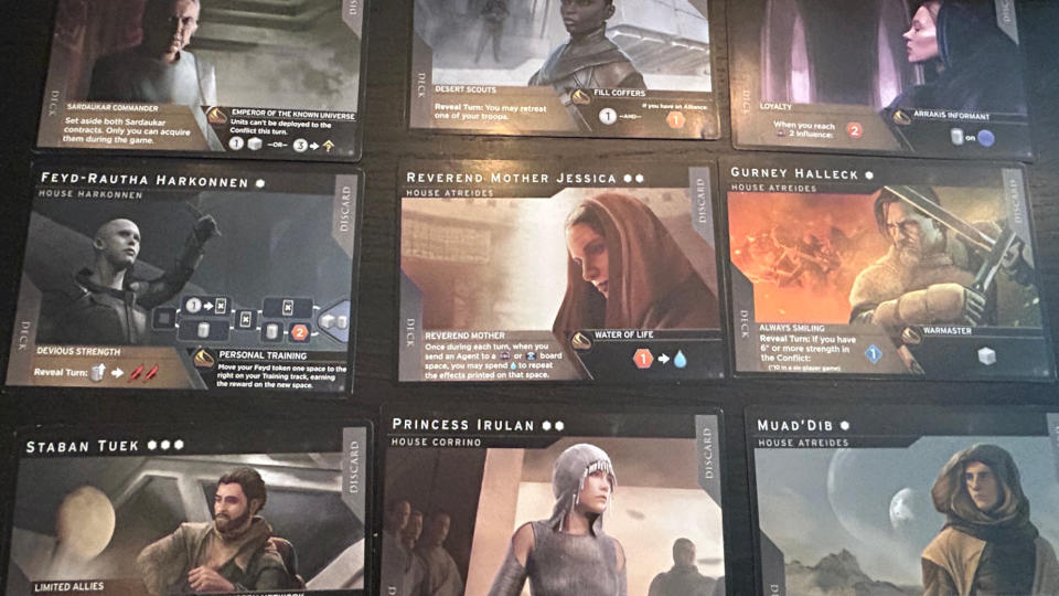 Dune: Imperium - Uprising cards laid out in a grid on a dark surface