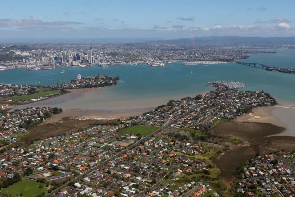 Auckland Harbour and the Sky Tower and the Harbour Bridge in Auckland, New Zealand.