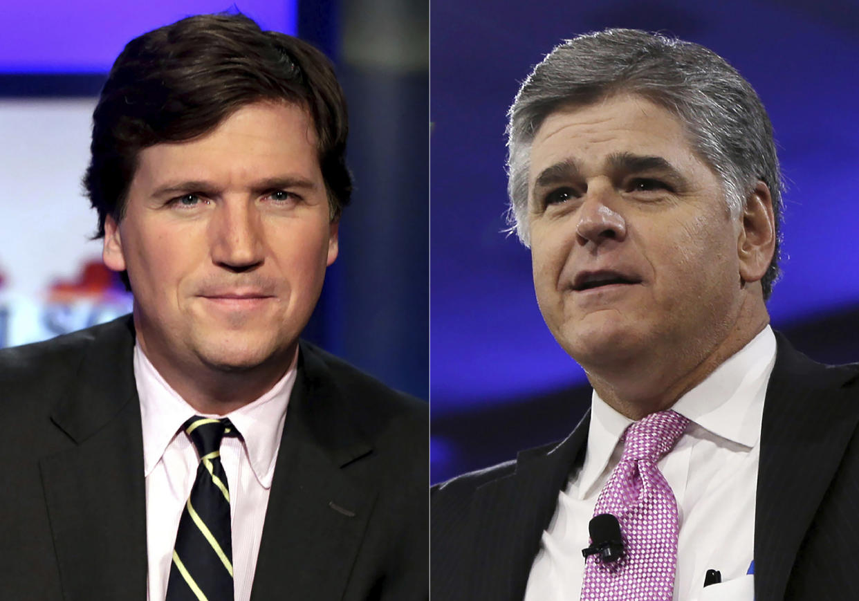 Fox News hosts Tucker Carlson, left, and Sean Hannity. (AP)