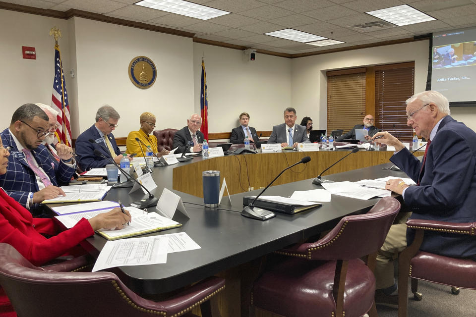 Georgia Senate Ethics Committee Chairman Max Burns, R-Sylvania, right, explains a bill that would ban private contributions to counties for elections, on Monday, Feb. 27, 2023, at the state Capitol in Atlanta. Burns is backing a measure that would make it easier to knock voters off the rolls based on residency questions. (AP Photo/Jeff Amy)