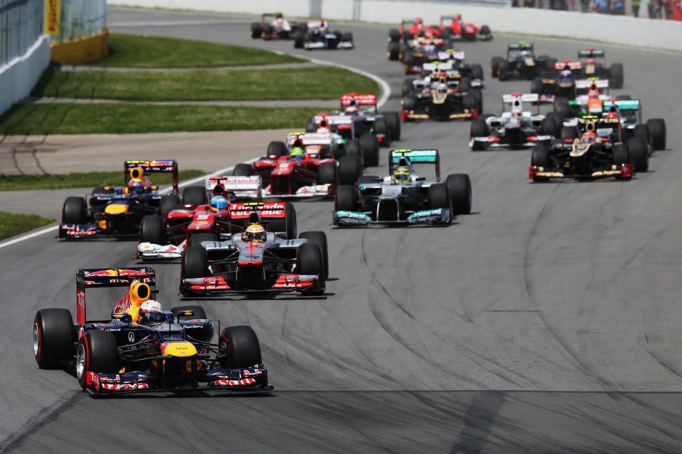 MONTREAL, CANADA - JUNE 10: Sebastian Vettel of Germany and Red Bull Racing leads the field into the first corner at the start of the Canadian Formula One Grand Prix at the Circuit Gilles Villeneuve on June 10, 2012 in Montreal, Canada. (Photo by Mark Thompson/Getty Images)