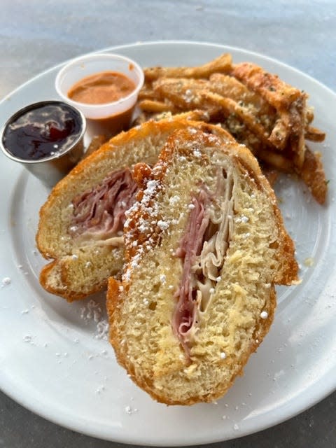 The crispy Monte Cristo is a fan favorite dish at Disneyland, but the Pommes Frites served alongside it Cafe Orleans made the dish for me.