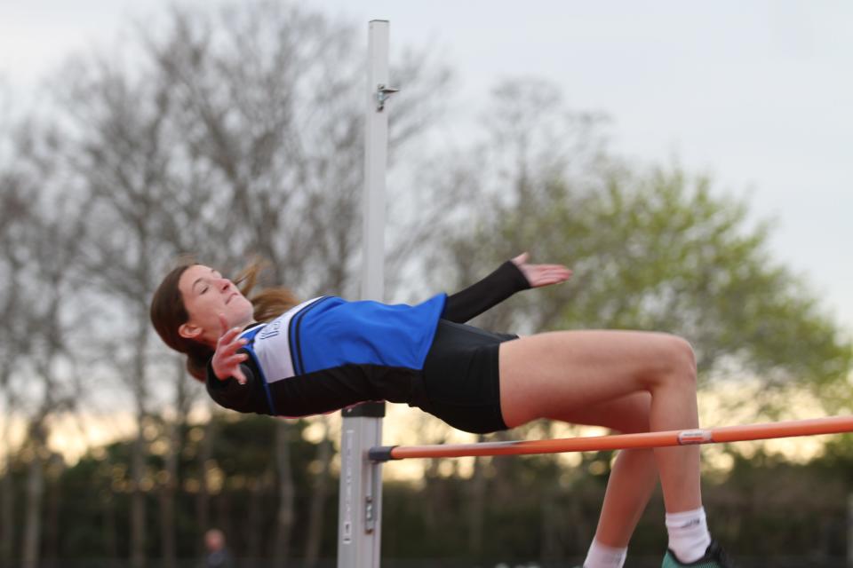 Middletown High School sophomore Katelin Cruikshank clears the high jump bar at a meet in April.