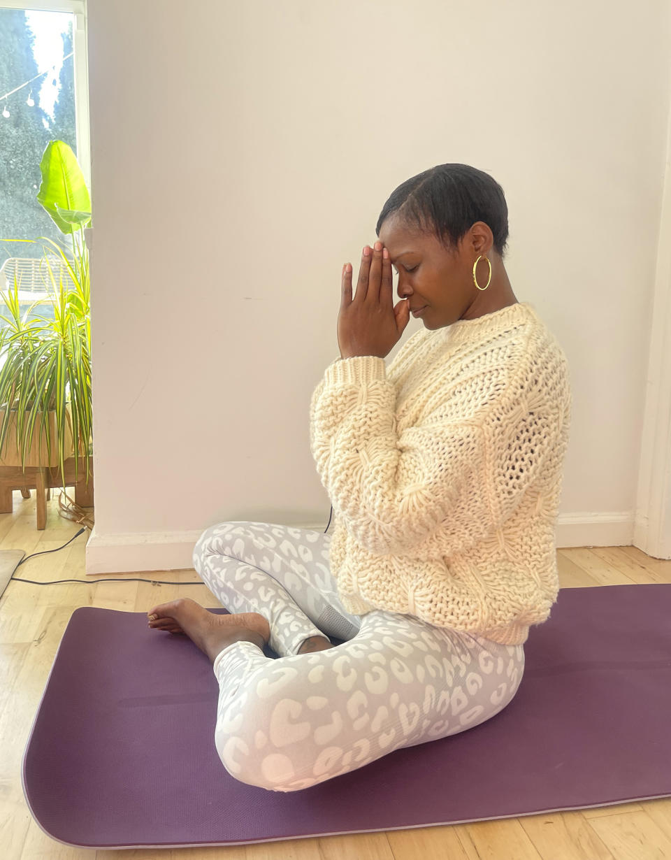 Marcelle Hutchins meditates in her studio in West Hollywood, Calif. on Jan. 13, 2024. Research shows a daily meditation practice can reduce anxiety, improve overall health and increase social connections, among other benefits. (Marcelle Hutchins via AP)