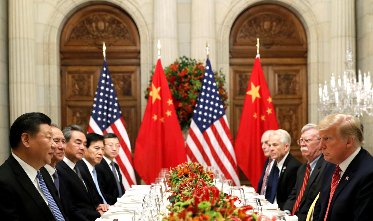 FILE PHOTO: U.S. President Donald Trump, U.S. Secretary of State Mike Pompeo, U.S. President Donald Trump's national security adviser John Bolton and Chinese President Xi Jinping attend a working dinner after the G20 leaders summit in Buenos Aires, Argentina December 1, 2018. Photo: REUTERS/Kevin Lamarque/File Photo