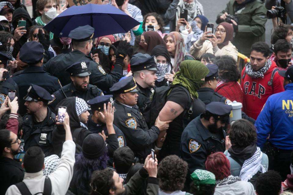 NYPD officers arrest anti-Israel protesters in front of Columbia University. Michael Nagle