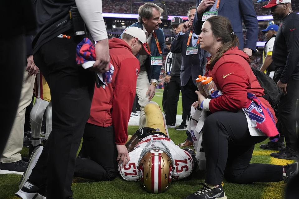 San Francisco 49ers linebacker Dre Greenlaw (57) is helped after an injury against the Kansas City Chiefs during the first half of the NFL Super Bowl 58 football game Sunday, Feb. 11, 2024, in Las Vegas. (AP Photo/George Walker IV)
