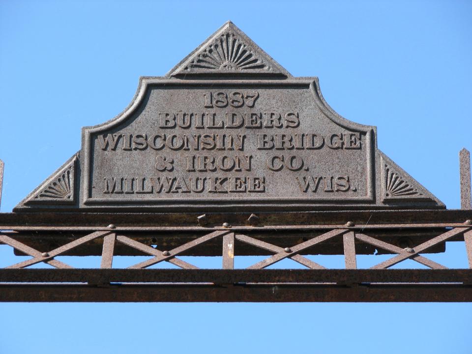 1887 plaque on the Manitowoc Rapids iron bridge.