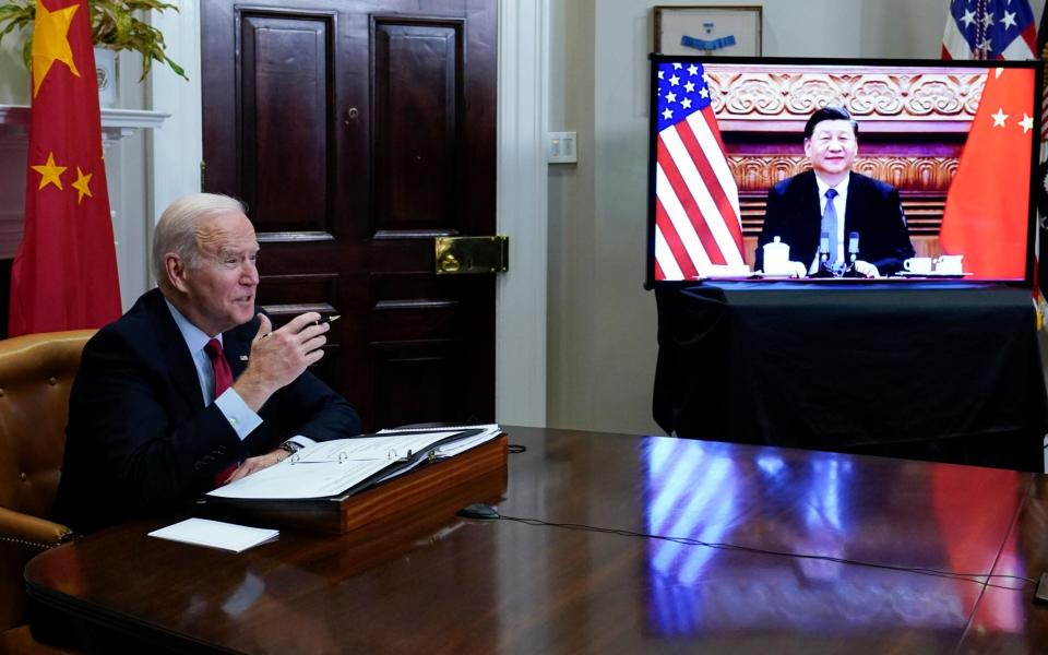 President Joe Biden meets virtually with Chinese President Xi Jinping  - Susan Walsh/AP