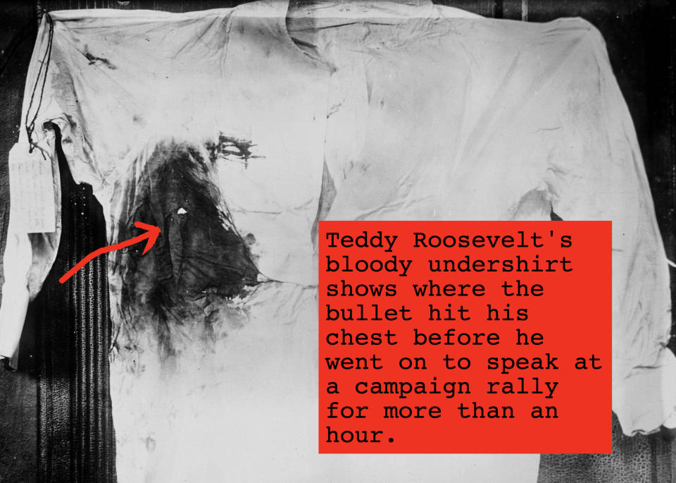 Roosevelt's torn and blood-stained shirt with a tag attached to the sleeve, lying flat on a table