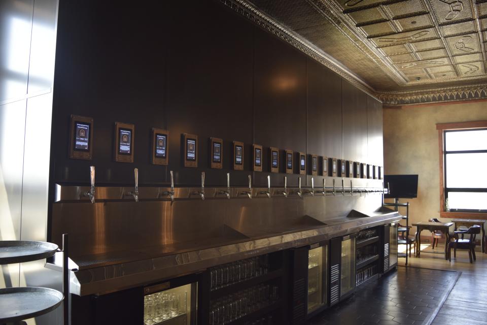 The tap wall in The Hops at The Farm and The Odd Fellows allows customers to self-serve 14 unique beers brewed in house. The Hops also keeps the original tin ceiling of the century-old building with Odd Fellows symbols still intact.