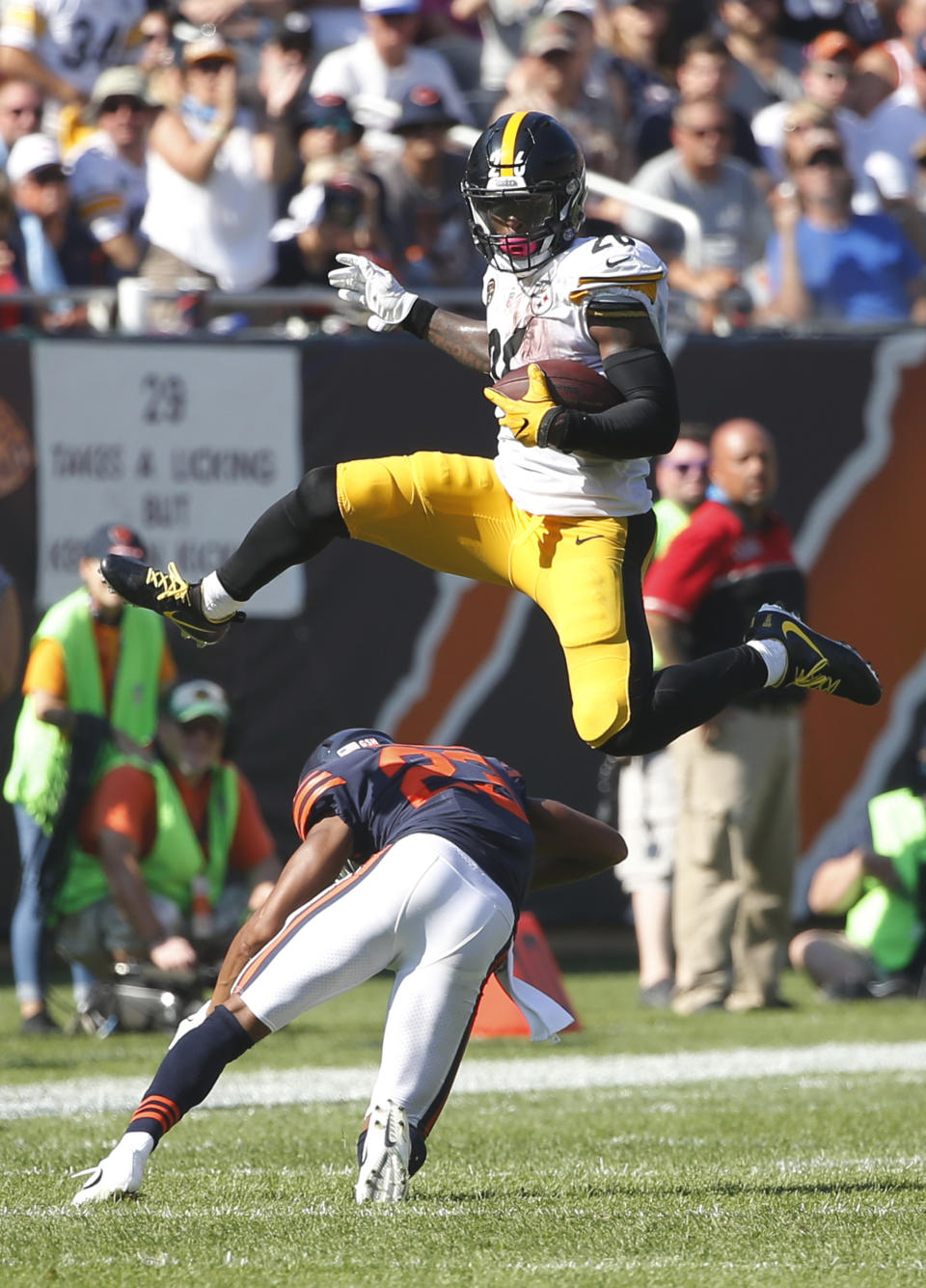 <p>Pittsburgh Steelers running back Le’Veon Bell (26) leaps over Chicago Bears cornerback Kyle Fuller (23) during the second half of an NFL football game, Sunday, Sept. 24, 2017, in Chicago. (AP Photo/Charles Rex Arbogast) </p>