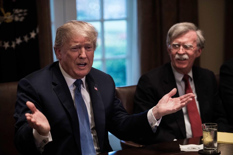 President Trump speaks during a meeting with senior military leaders at the White House in Washington, D.C., on Monday. At right is new national security adviser John Bolton. (Photo: Nicholas Kamm/AFP/Getty Images)