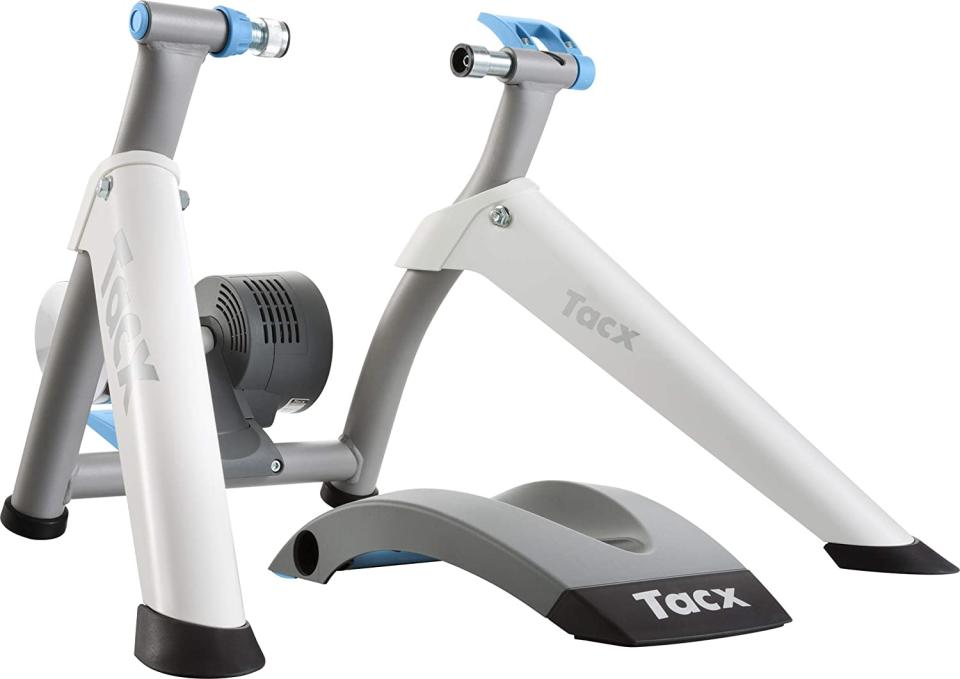 Tacx Flow Smart Turbo Trainer in the image comes with the front wheel riser block which is shown in the middle of the turbo legs