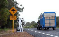 PERTH, AUSTRALIA - JULY 15: Stormtrooper Paul French is pictured on day 5 of his over 4,000 kilometre journey from Perth to Sydney waving to traffic on Old Mandurah Road on July 15, 2011 in Perth, Australia. French aims to walk 35-40 kilometres a day, 5 days a week, in full Stormtrooper costume until he reaches Sydney. French is walking to raise money for the Starlight Foundation - an organisation that aims to brighten the lives of ill and hostpitalised children in Australia. (Photo by Paul Kane/Getty Images)