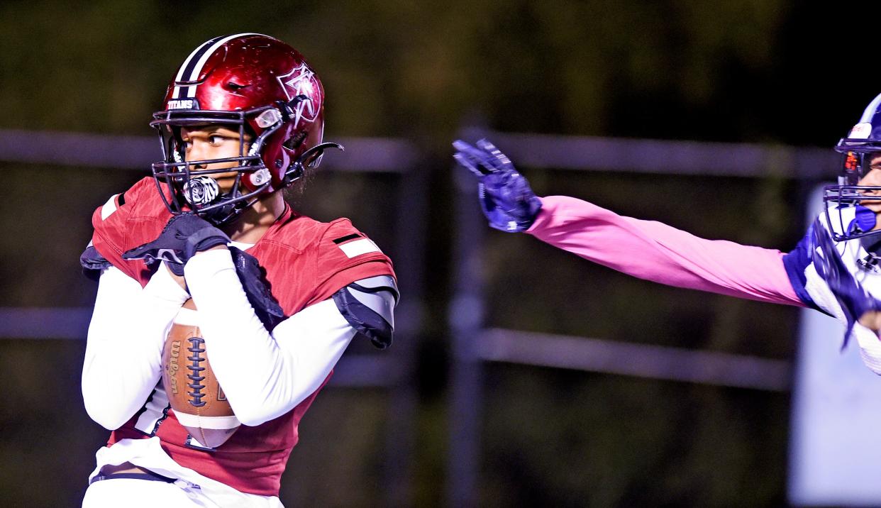 Gadsden City's Clyde Curry makes a touchdown catch as Lee Huntsville's Tyson Pryor defends during high school football action on Oct. 14, 2022, in Gadsden. Curry, who set single-season school records for receptions, touchdown catches and receiving yardage as a senior, has signed a scholarship with Arkansas State.