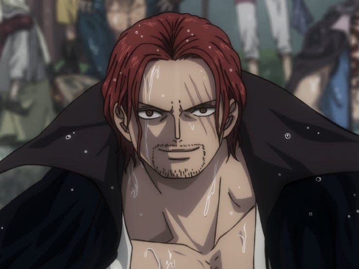 shanks in one piece film red. he's an animated man with medium long red hair, a low cut shirt, and black coat, with three scars across his left eye