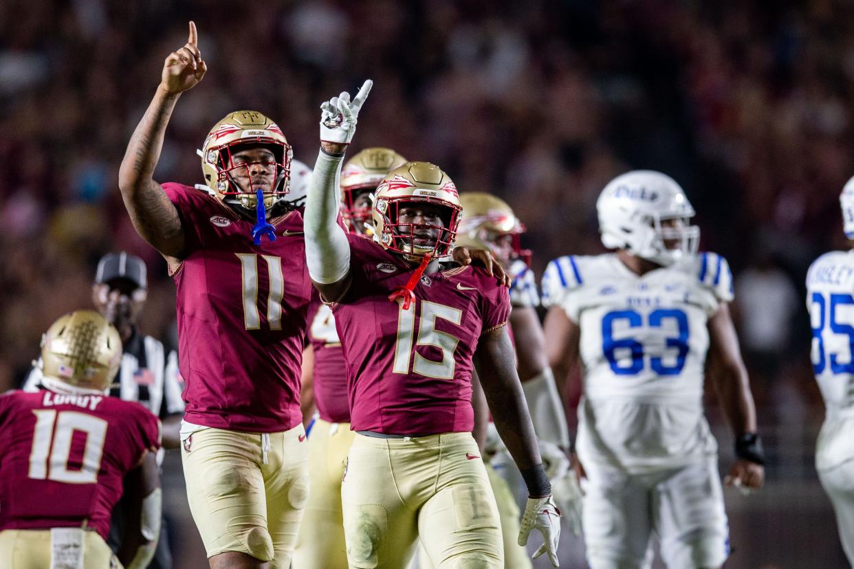 Florida State Seminoles defensive lineman Patrick Payton (11) and Florida State Seminoles linebacker Tatum Bethune (15) celebrate an incomplete pass for Duke. The Florida State Seminoles defeated the Duke Blue Devils 38-20 on Saturday, Oct. 21, 2023.
