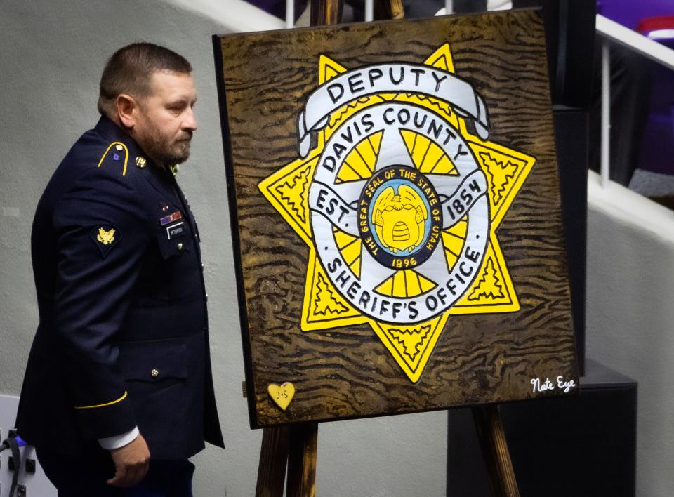 Daryl Peterson II, brother of deputy Jennifer Turner, returns to his seat after speaking about his sister during the memorial service for Turner and Cpl. Steven Lewis at the Dee Events Center in Ogden on Friday, July 14, 2023. Lewis and Turner were killed in a wrong-way crash near the intersection of South Weber Drive and Canyon Meadows Drive on Monday, July 3. | Laura Seitz, Deseret News