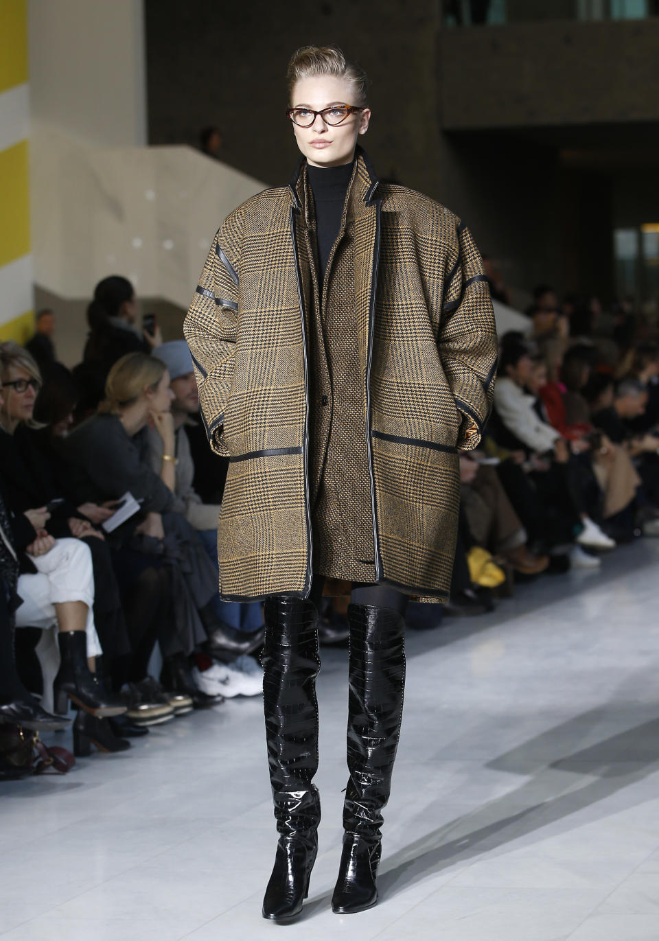 A model wears a creation as part of the Max Mara women's Fall-Winter 2019-20 collection, unveiled during the Fashion Week in Milan, Italy, Thursday, Feb. 21, 2019. (AP Photo/Antonio Calanni)