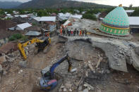 <p>An aerial view of the collapsed Jamiul Jamaah mosque where rescue workers and soldiers search for earthquake victims in Pemenang, North Lombok, Indonesia, Aug. 8, 2018. (Photo: Antara Foto/Zabur Karuru via Reuters) </p>