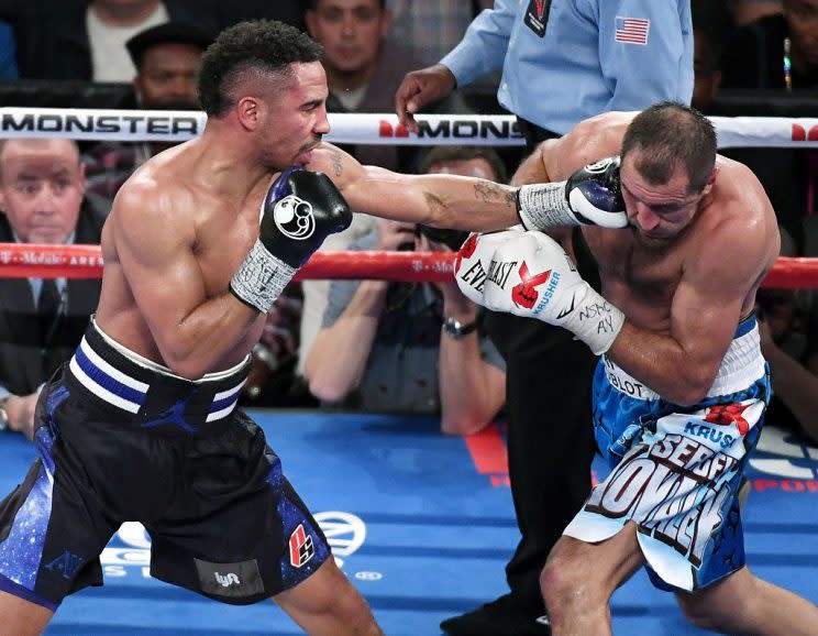 Andre Ward and Sergey Kovalev trade blows during their first fight. (Getty)