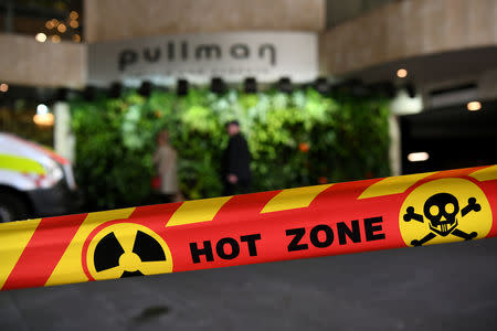 Emergency service workers at the scene of a chemical leak at the Pullman Hotel in Sydney, Australia, September 19, 2018. AAP/Joel Carrett/via REUTERS