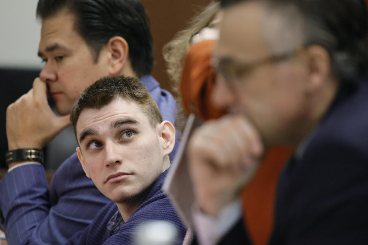 Marjory Stoneman Douglas High School shooter Nikolas Cruz sits at the defense table during jury selection in the penalty phase of his trial at the Broward County Courthouse in Fort Lauderdale, Fla., on Wednesday, June 29, 2022. A jury of seven men and five women have been sworn in for the penalty trial of Cruz. The final selections were made Wednesday with the defense using its final strikes to eliminate a banking executive and retired insurance executive who had tentatively been accepted Tuesday. (Amy Beth Bennett/South Florida Sun-Sentinel via AP, Pool)