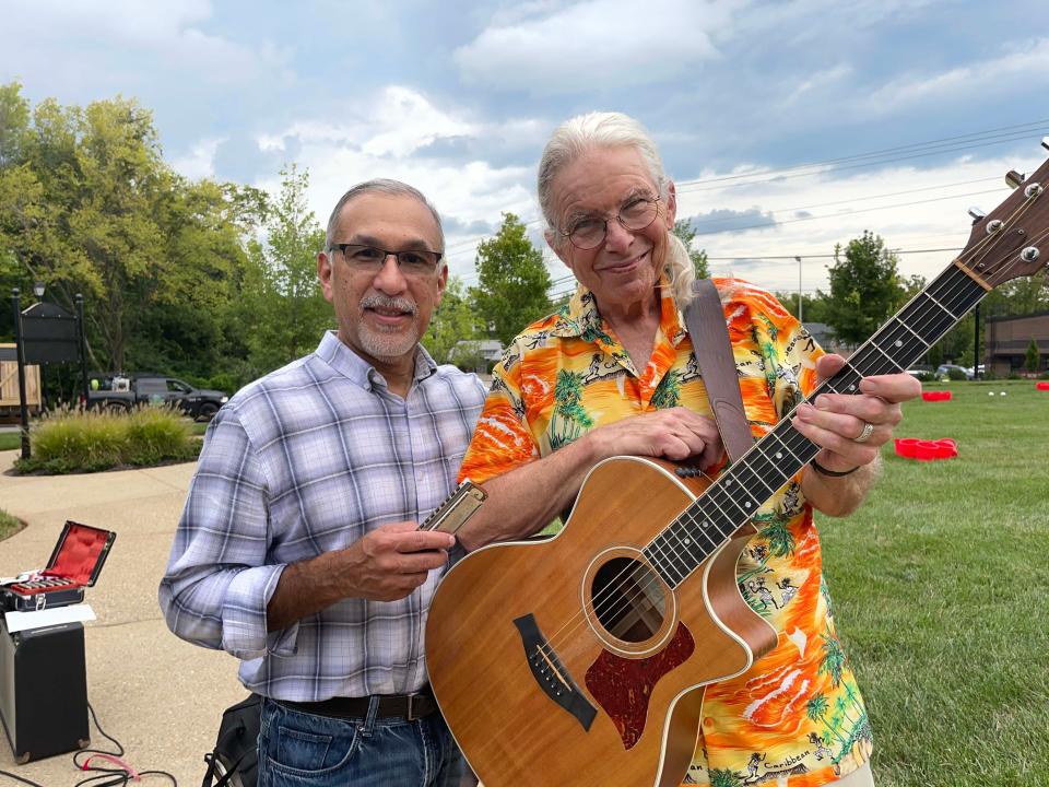 Blues duo Ray Beltram and Rob Higginbotham of Blue Max play tunes at the Food Truck Freedom Field Day event held at Mayor Ralph McGill Plaza in Farragut Saturday, Aug. 20, 2022.