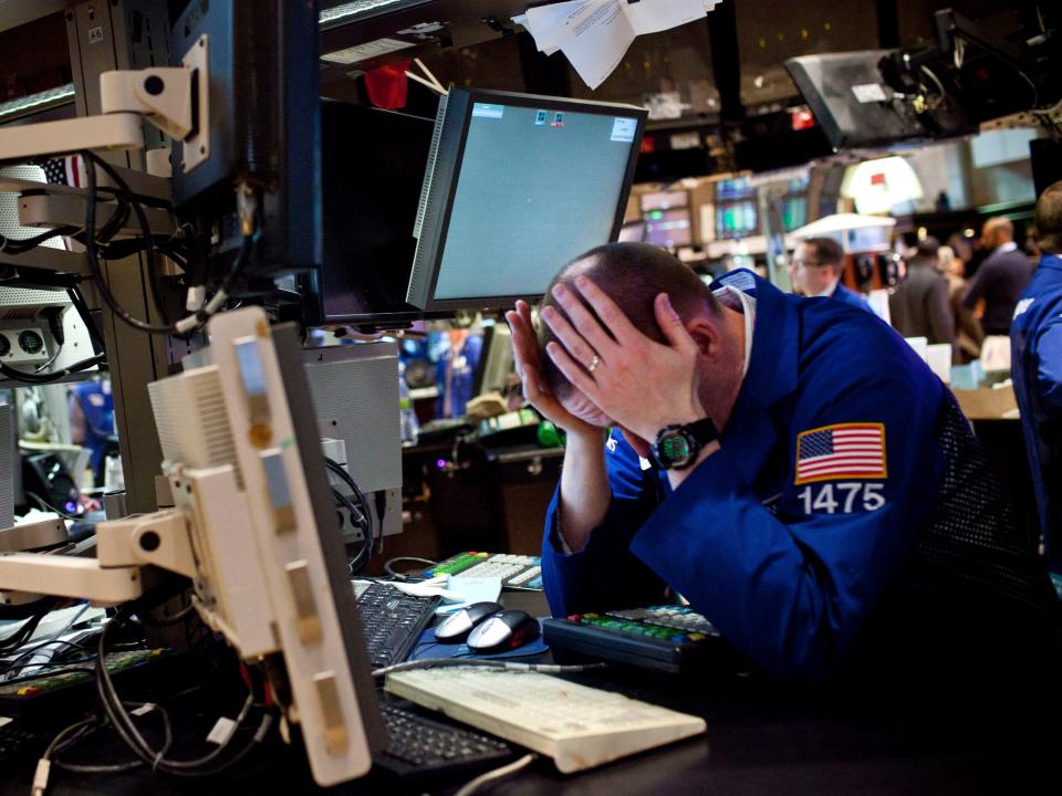 new york stock exchange trader wall street headache sad