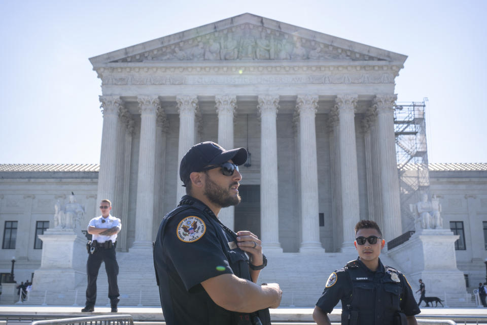 Supreme Court Police officers stand on duty outside of the Supreme Court building on Thursday, June 13, 2024, in Washington. (AP Photo/Mark Schiefelbein)