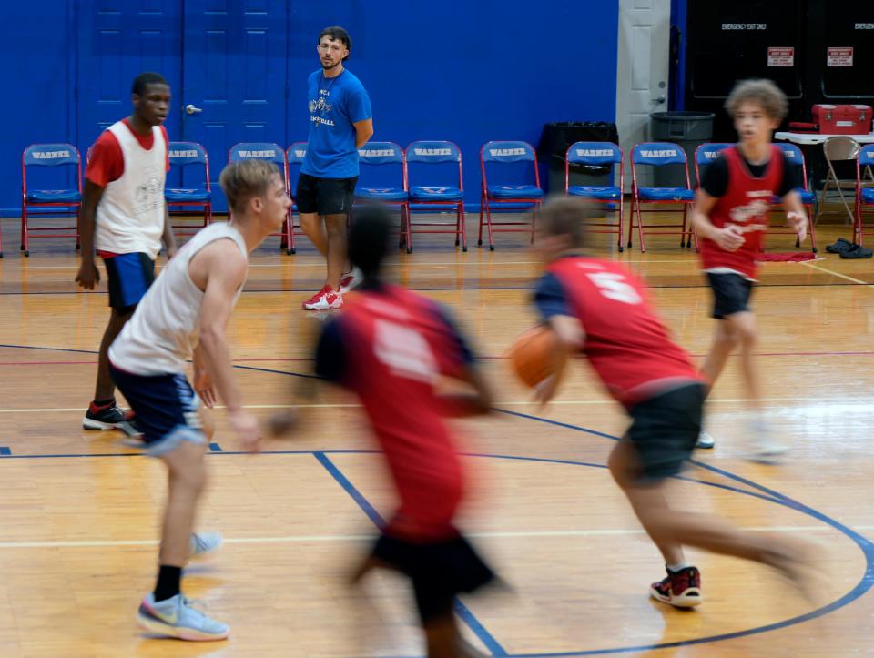 Warner Christian Academy basketball coach Matt MacGinnis watches a drill during practice at the school in South Daytona, Wednesday, Nov. 22, 2023.