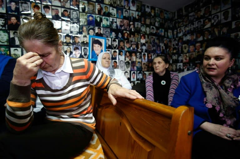 Bosnian Muslim women, survivors of July 1995 massacre in Srebrenica, react as they watch a live broadcast of the verdict in the trial of former Bosnian Serb leader Radovan Karadzic, in Tuzla on March 24, 2016