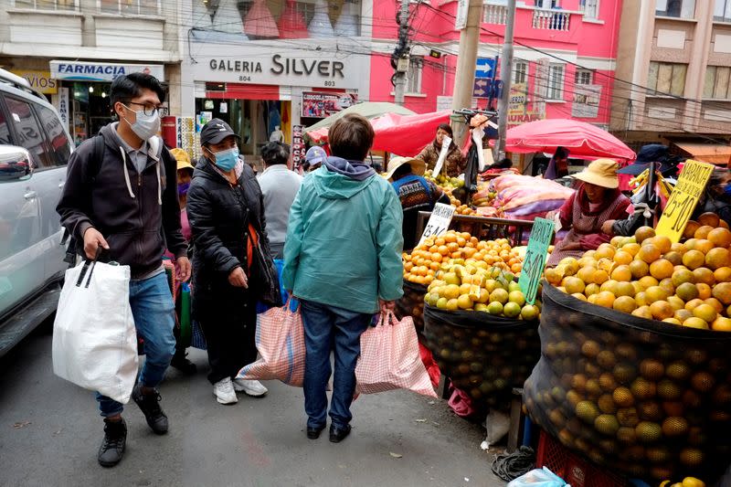 People buy food at the Rodriguez market in La Paz