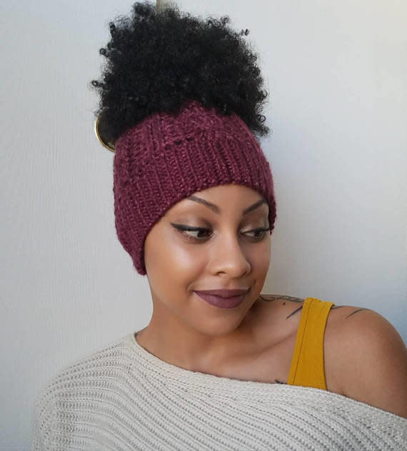 This <a href="https://www.etsy.com/listing/575801849/cable-knit-messy-bun-beanie-knit?ga_order=most_relevant&amp;ga_search_type=all&amp;ga_view_type=gallery&amp;ga_search_query=hats%20for%20natural%20hair&amp;ref=sr_gallery_3" target="_blank">messy bun beanie with satin lining</a> is perfect for protective styles or updos when it's close to wash day.