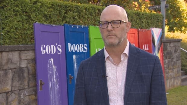 Rev. Dave Moors of Shaughnessy Heights United Church says even if vandals attack the installation again, staff will do whatever it takes to repair and re-display what Moors says is a symbol of the congregation's love.  (CBC News - image credit)