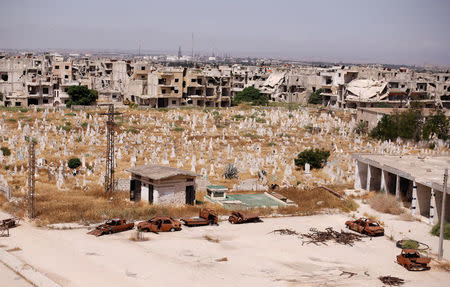 A view of damaged buildings and graves in the Baba Amr neighbourhood of Homs, Syria July 28, 2017. Picture taken July 28, 2017. REUTERS/Omar Sanadiki