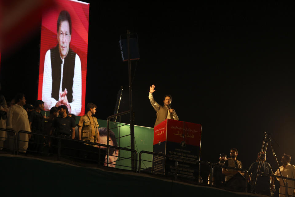 Pakistani opposition leader Imran Khan, center, addresses his party supporters during a rally in Peshawar, Pakistan, Tuesday, Sept. 6, 2022. Since he was toppled by parliament five months ago, former Prime Minister Imran Khan has demonstrated his popularity with rallies that have drawn huge crowds and signaled to his rivals that he remains a considerable political force. (AP Photo/Mohammad Sajjad)