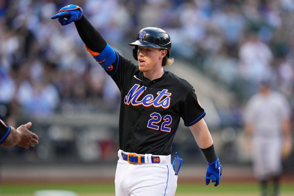 New York Mets' Brett Baty (22) gestures to teammates after hitting an RBI single during the first inning against the New York Yankees on Tuesday, June 13, 2023, in New York. (AP Photo/Frank Franklin II)