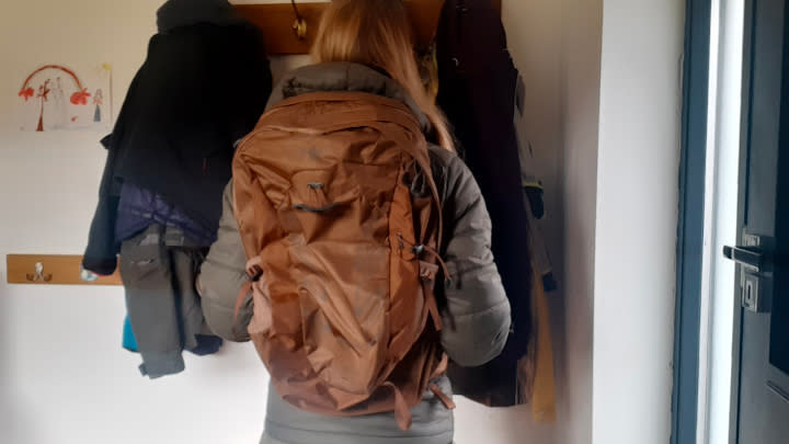  Fitness writer Lily Canter wearing the Osprey Talon Earth 22 backpack 