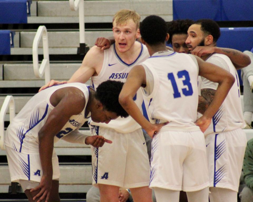 Former Bishop Connolly standout and 2018-19 Herald News Boys Basketball Player of the Year and current Assumption junior Cooper Creek (center) talks with teammates during a game against St. Michael’s College.