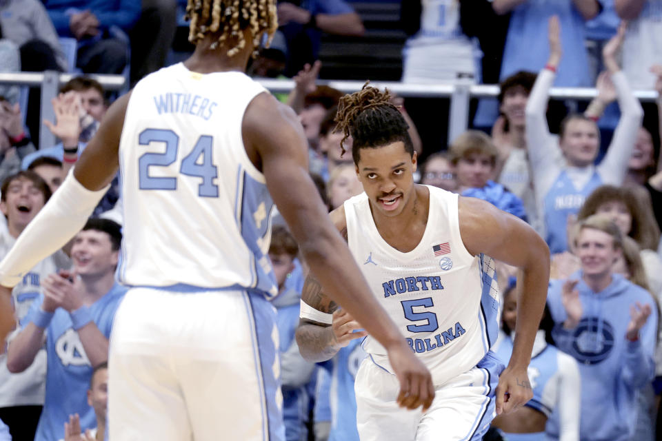 North Carolina forward Armando Bacot (5) celebrates after his dunk with forward Jae'Lyn Withers (24) during the second half of an NCAA college basketball game against Lehigh, Sunday, Nov. 12, 2023, in Chapel Hill, N.C. (AP Photo/Chris Seward)