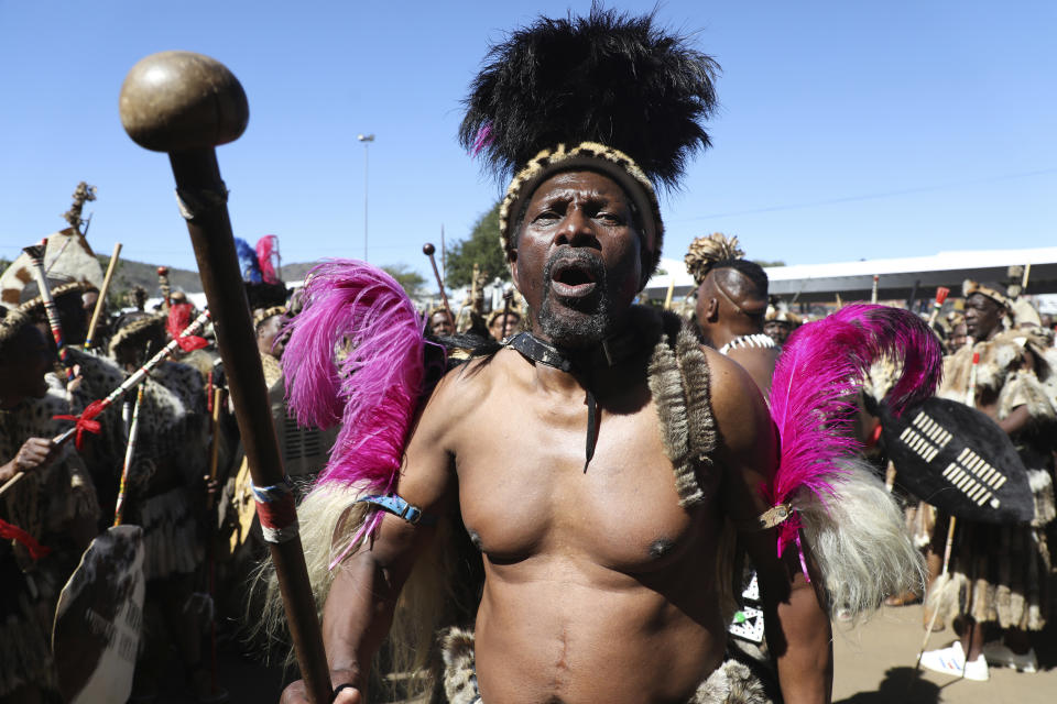 A Zulu man sings and dances at King Misuzulu ka Zwelithini's coronation event, at KwaKhangelamankengane Royal Palace in Nongoma, South Africa. Saturday, Aug. 20, 2022. South Africa’s ethnic Zulu nation hosted a coronation event for its new traditional king amid internal divisions that have threatened to tear the royal family apart. King Misuzulu ka Zwelithini, a son of the late King Goodwill Zwelithini who died from a diabetes-related illness in March last year, will undergo the traditional ritual known as ukungena esibayeni (entering the royal village) to mark his installation as the new leader of the Zulu nation. (AP Photo)