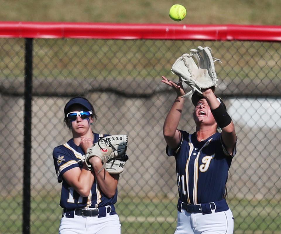 Talmadge's Lexi Gray pulls back as Mia Zappola catches a fly ball of the out against Greenville in the Div. II state semifinal softball at Firestone Stadium in Akron.
