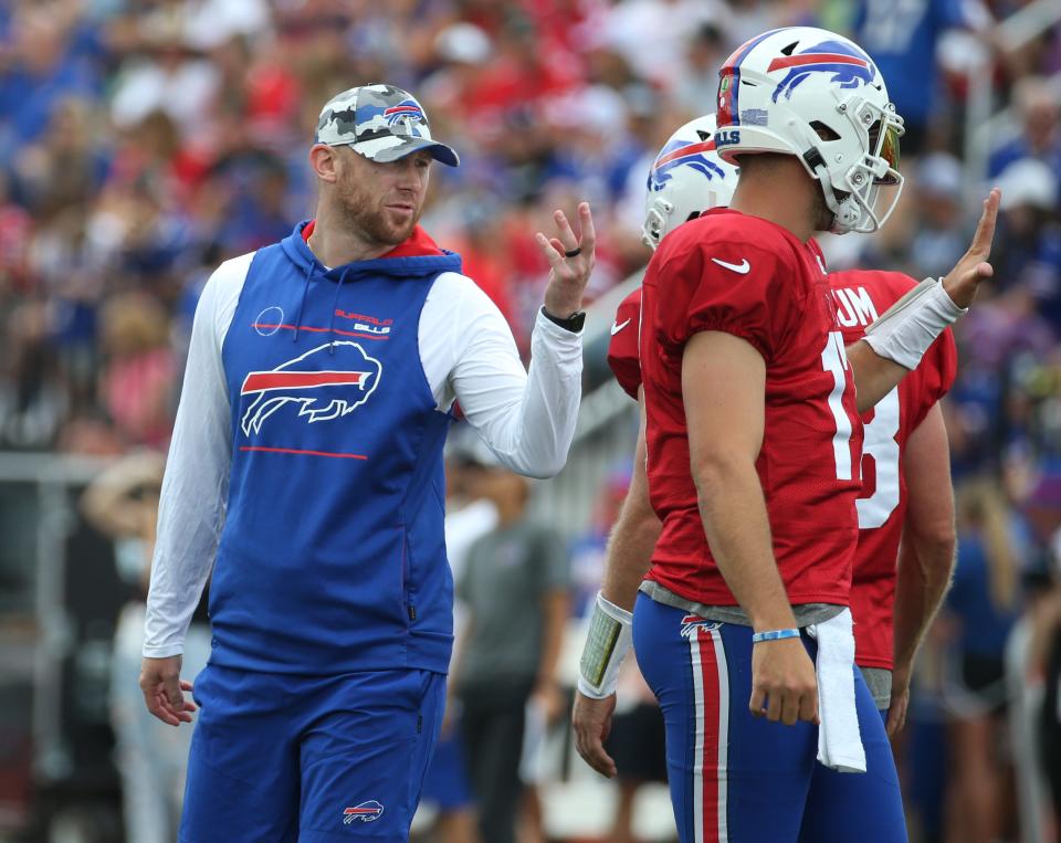 Bills quarterbacks coach Joe Brady, left, goes over plays with Josh Allen during day six of the Buffalo Bills training camp at St John Fisher University in Rochester Saturday, July 30, 2022.<br>Sd 073022 Bills Camp 21 Spts