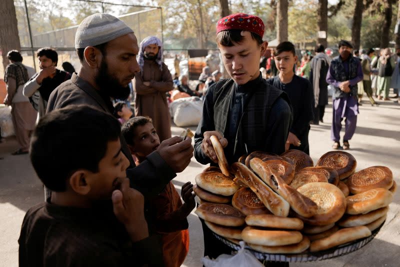 FILE PHOTO: Displaced Afghan families, who flee the violence in their provinces, at a makeshift shelter in Kabul