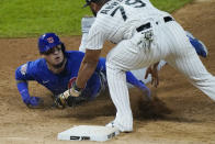 Chicago Cubs' Javier Baez, left, is tagged out by Chicago White Sox first baseman Jose Abreu during the seventh inning of a baseball game in Chicago, Friday, Sept. 25, 2020. (AP Photo/Nam Y. Huh)