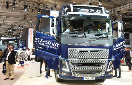 FILE PHOTO: Visitors surround a Volvo FH16 truck at the booth of Swedish truck maker Volvo at the IAA truck show in Hanover, September 22, 2016. REUTERS/Fabian Bimmer/File Photo