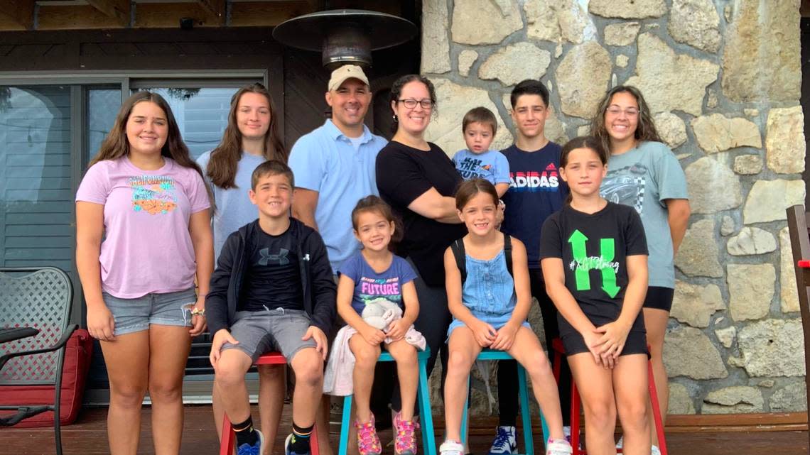 Charles Criniere is pictured with his wife, Megan, and nine of their 10 children. Criniere was killed in a hit-and-run crash Sat. Aug. 27, 2022, when he was struck by a vehicle while riding his bicycle in Kansas City. Photo courtesy of family