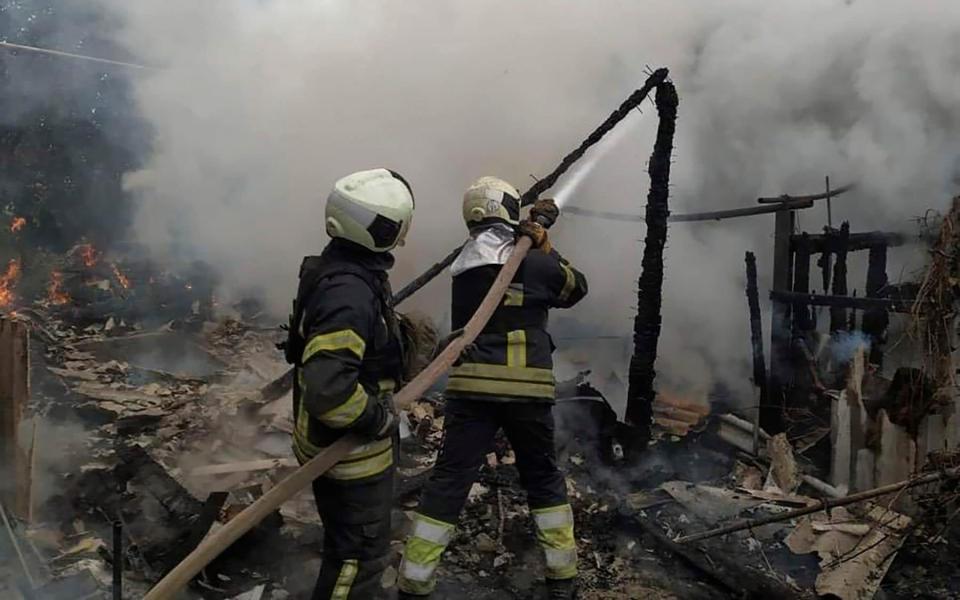 Firefighters work to extinguish a fire at a residential building in Lysychansk, which has now been captured by the Russians